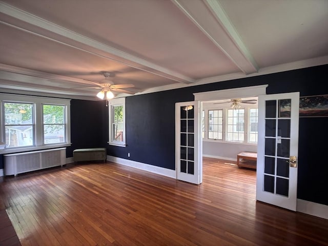 29 Neptune Ave, West Springfield, MA 01089 - unfurnished room featuring radiator, ceiling fan, beamed ceiling, dark wood finished floors, and healthy amount of natural light