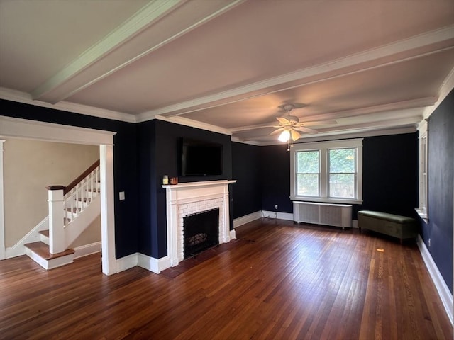 29 Neptune Ave, West Springfield, MA 01089 - unfurnished living room with radiator heating unit, dark wood-style flooring, beam ceiling, a fireplace, and stairs