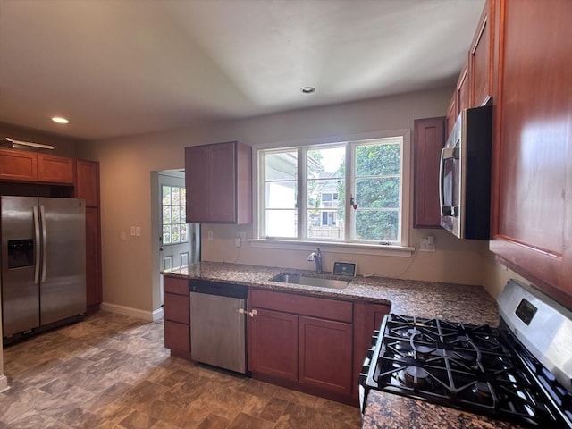 29 Neptune Ave, West Springfield, MA 01089 - kitchen with stainless steel appliances, a sink, light stone countertops, brown cabinets, and recessed lighting