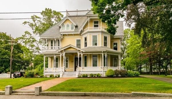117 Church St Unit 4, North Attleboro, MA 02760 - victorian-style house with a porch, a balcony, and a front lawn