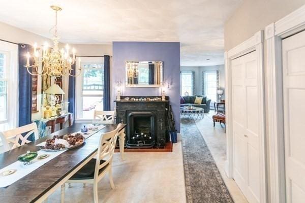 117 Church St Unit 4, North Attleboro, MA 02760 - dining space with a chandelier and a fireplace