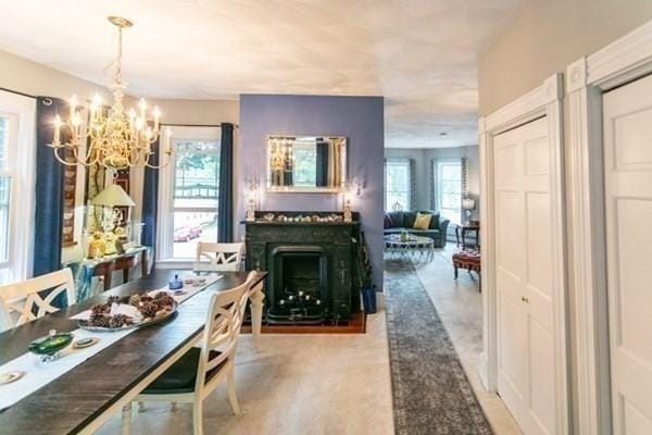 117 Church St Unit 4, North Attleboro, MA 02760 - dining area with a fireplace and a notable chandelier