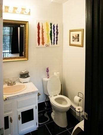 117 Church St Unit 4, North Attleboro, MA 02760 - half bathroom featuring toilet, tile patterned floors, and vanity