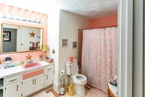 117 Church St Unit 4, North Attleboro, MA 02760 - bathroom with toilet, a shower with curtain, tile patterned flooring, and vanity