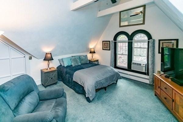 117 Church St Unit 4, North Attleboro, MA 02760 - carpeted bedroom with a baseboard radiator, a ceiling fan, cooling unit, and vaulted ceiling