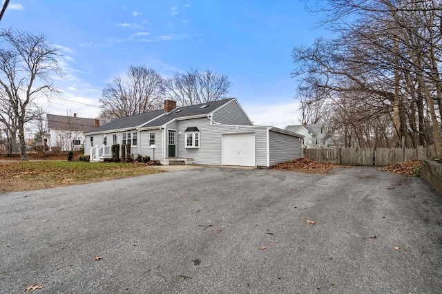 ranch-style home with a garage