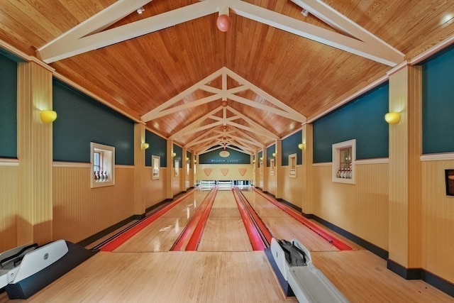 playroom with a healthy amount of sunlight, wood ceiling, a bowling alley, and vaulted ceiling