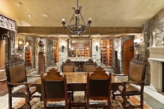 interior space featuring a textured ceiling and a notable chandelier