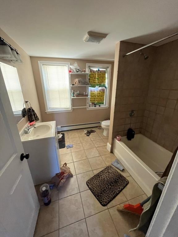 full bathroom featuring tile patterned floors, vanity, a baseboard radiator, toilet, and tiled shower / bath