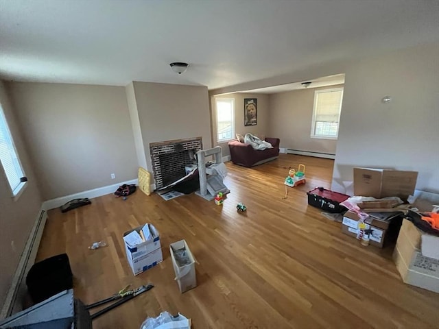 living room featuring hardwood / wood-style floors and a baseboard radiator