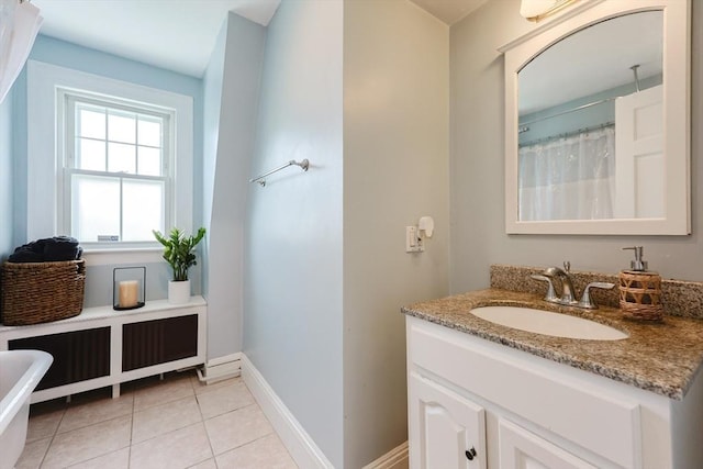 30 Crystal Cove Ave Unit 2, Winthrop, MA 02152 - bathroom featuring vanity, baseboards, tile patterned flooring, a freestanding tub, and a shower with shower curtain