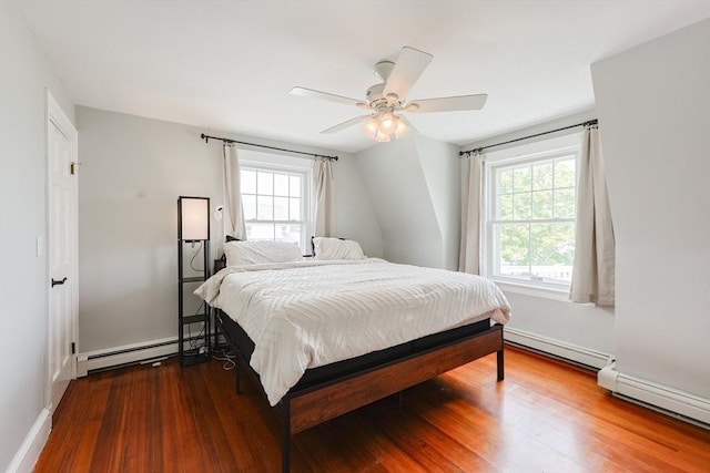 30 Crystal Cove Ave Unit 2, Winthrop, MA 02152 - bedroom with baseboard heating, multiple windows, and wood finished floors