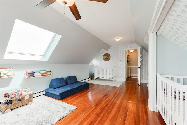 30 Crystal Cove Ave Unit 2, Winthrop, MA 02152 - bedroom with hardwood / wood-style floors, vaulted ceiling, a baseboard heating unit, ceiling fan, and wallpapered walls