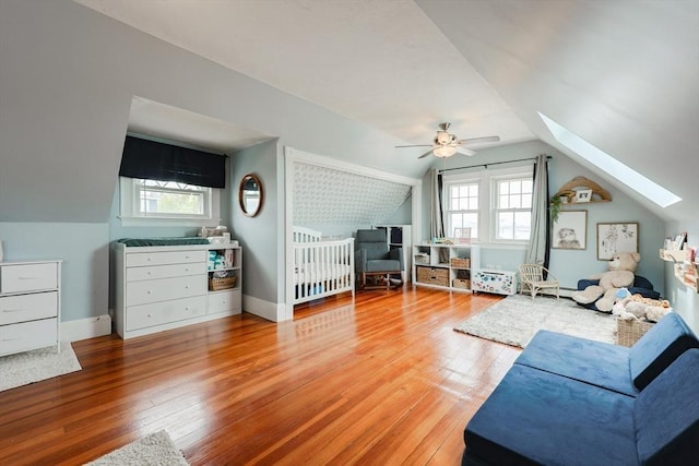 30 Crystal Cove Ave Unit 2, Winthrop, MA 02152 - living room with ceiling fan, a skylight, lofted ceiling, and hardwood / wood-style floors