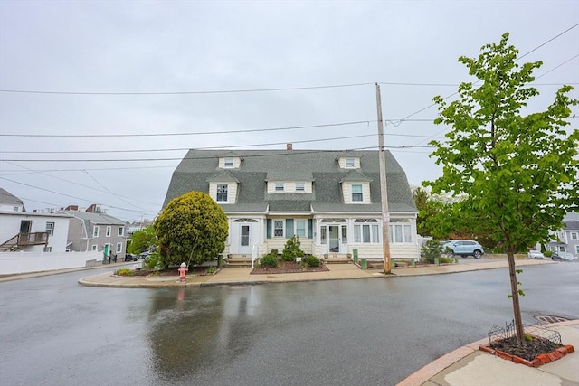 30 Crystal Cove Ave Unit 2, Winthrop, MA 02152 - view of front of property featuring entry steps, roof with shingles, a gambrel roof, and fence