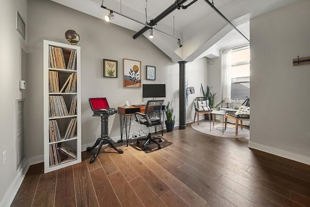 office space with hardwood / wood-style flooring and rail lighting