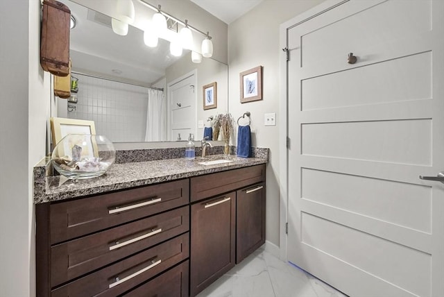 bathroom featuring vanity and curtained shower