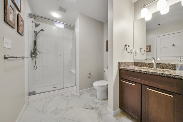 bathroom with vanity, toilet, and walk in shower