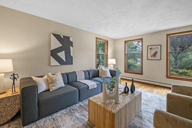 5 Ledgewood Rd, Saugus, MA 01906 - living area with a baseboard heating unit and light wood-style flooring