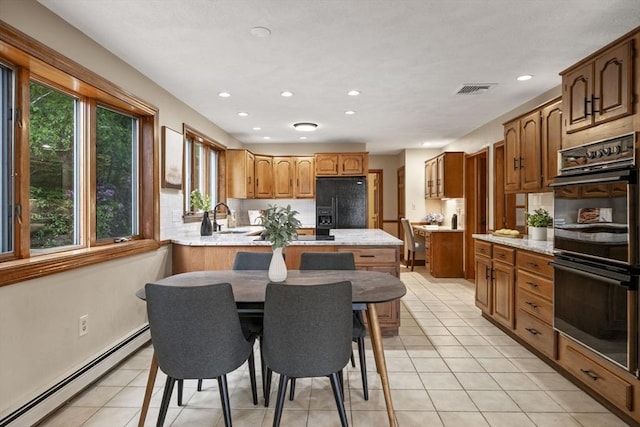 5 Ledgewood Rd, Saugus, MA 01906 - kitchen with baseboard heating, black appliances, healthy amount of natural light, a peninsula, and recessed lighting