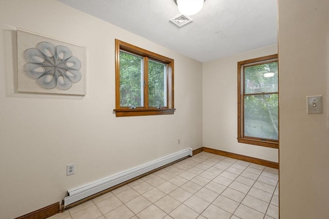 5 Ledgewood Rd, Saugus, MA 01906 - empty room with baseboard heating, plenty of natural light, and a textured ceiling