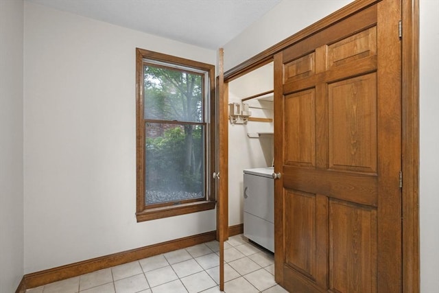 5 Ledgewood Rd, Saugus, MA 01906 - doorway to outside featuring washer / dryer and baseboards