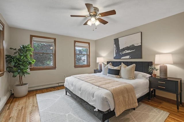 5 Ledgewood Rd, Saugus, MA 01906 - bedroom featuring a baseboard radiator, wood finished floors, and a ceiling fan