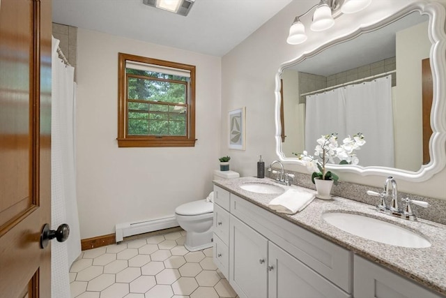 5 Ledgewood Rd, Saugus, MA 01906 - bathroom featuring baseboard heating, double vanity, tile patterned floors, and a shower with shower curtain