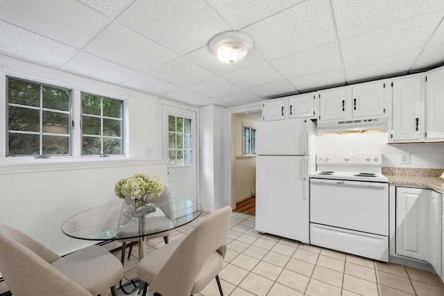 5 Ledgewood Rd, Saugus, MA 01906 - kitchen with white appliances, under cabinet range hood, a paneled ceiling, light tile patterned floors, and white cabinetry
