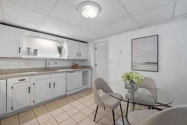 5 Ledgewood Rd, Saugus, MA 01906 - kitchen featuring white dishwasher, a drop ceiling, white cabinets, tasteful backsplash, and light tile patterned flooring