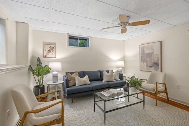 5 Ledgewood Rd, Saugus, MA 01906 - living room featuring a drop ceiling, wood finished floors, baseboard heating, and ceiling fan