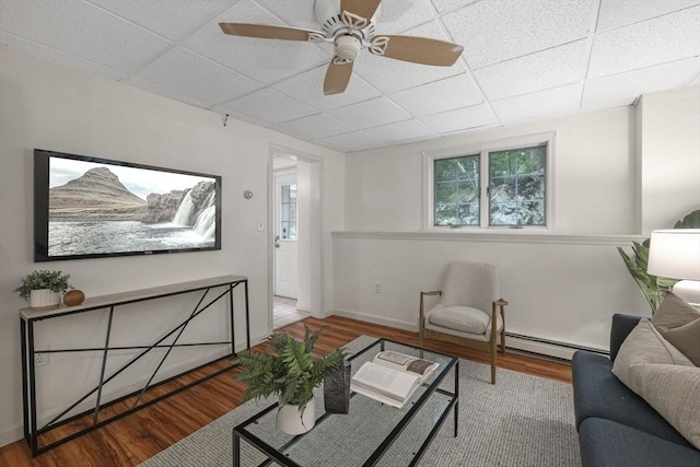 5 Ledgewood Rd, Saugus, MA 01906 - living area featuring a paneled ceiling, wood finished floors, a baseboard heating unit, and a ceiling fan