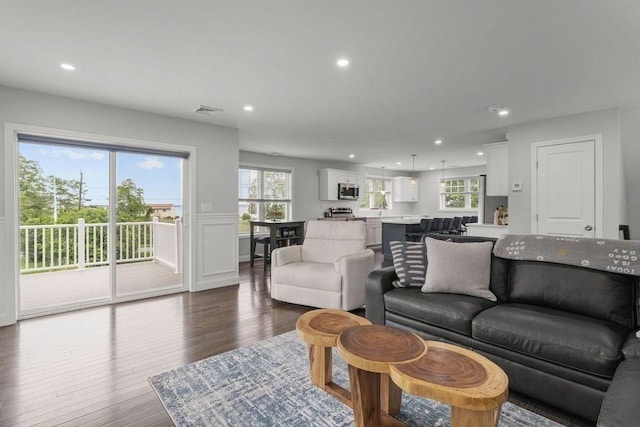 15 Spadina, Warwick, RI 02889 - living room with recessed lighting, dark wood-style flooring, and a wainscoted wall