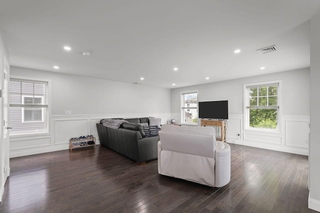 15 Spadina, Warwick, RI 02889 - living area with a wainscoted wall, healthy amount of natural light, a decorative wall, dark wood-style floors, and recessed lighting