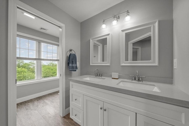 15 Spadina, Warwick, RI 02889 - full bathroom featuring double vanity and wood finished floors
