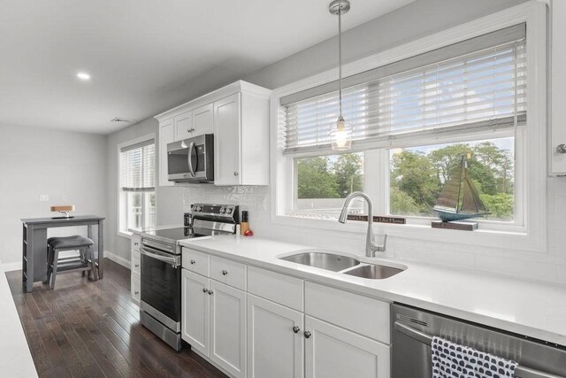 15 Spadina, Warwick, RI 02889 - kitchen with appliances with stainless steel finishes, plenty of natural light, decorative backsplash, light countertops, and recessed lighting