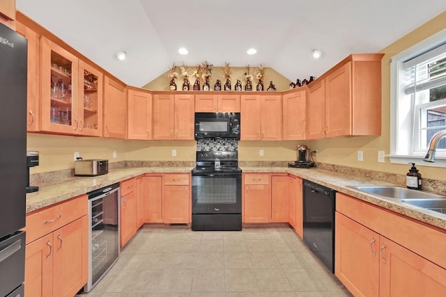 4063 Main St, Palmer, MA 01069 - kitchen with black appliances, wine cooler, lofted ceiling, light brown cabinets, and a sink