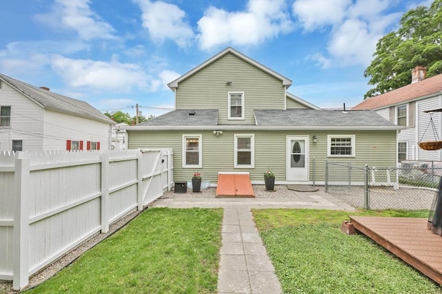 4063 Main St, Palmer, MA 01069 - rear view of house with a shingled roof and a patio area