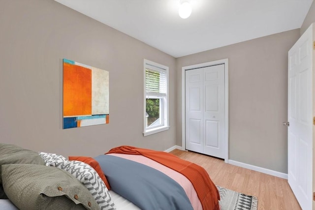 4063 Main St, Palmer, MA 01069 - bedroom featuring light wood-type flooring, baseboards, and a closet
