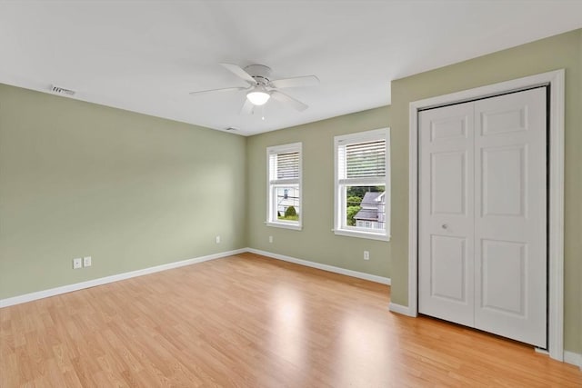 4063 Main St, Palmer, MA 01069 - unfurnished bedroom featuring light wood-style floors, baseboards, a ceiling fan, and a closet