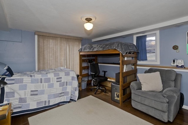 bedroom featuring wood finished floors