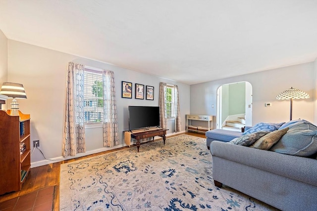 40 Mamie Rd, Weymouth, MA 02190 - living area featuring wood finished floors, baseboards, and arched walkways
