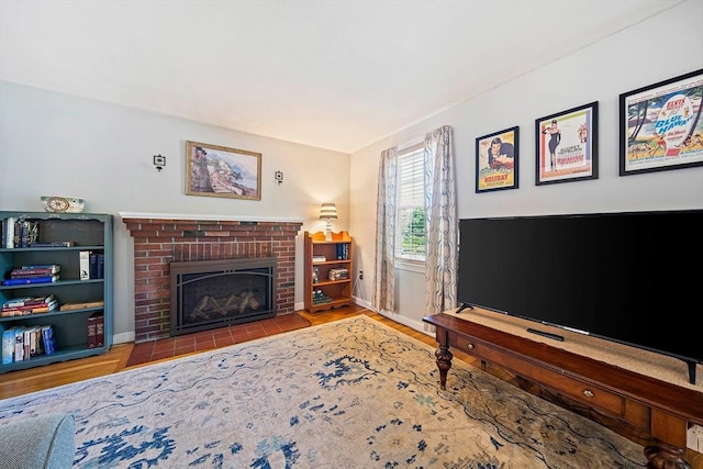 40 Mamie Rd, Weymouth, MA 02190 - living room featuring a brick fireplace, wood finished floors, and baseboards