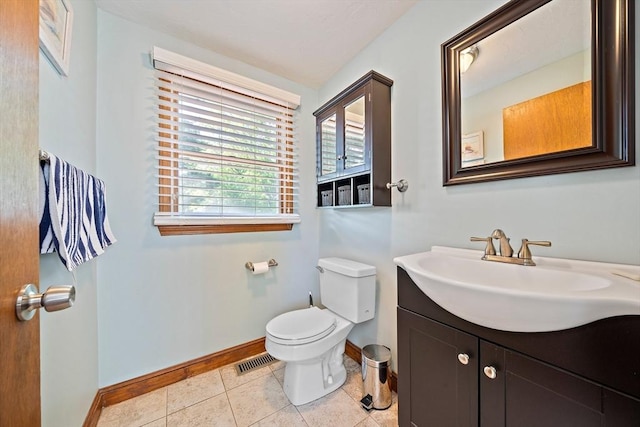 40 Mamie Rd, Weymouth, MA 02190 - half bath featuring toilet, baseboards, tile patterned floors, and vanity