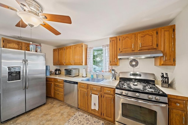 40 Mamie Rd, Weymouth, MA 02190 - kitchen featuring appliances with stainless steel finishes, under cabinet range hood, a sink, a ceiling fan, and light countertops