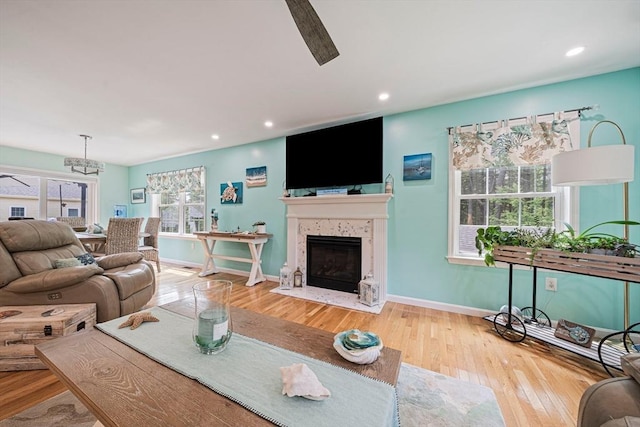61 Hingham Ave, Marshfield, MA 02050 - living area with wood-type flooring, recessed lighting, a fireplace with flush hearth, baseboards, and ceiling fan