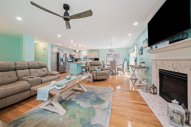 61 Hingham Ave, Marshfield, MA 02050 - living area with ceiling fan, light wood-style floors, recessed lighting, and a high end fireplace