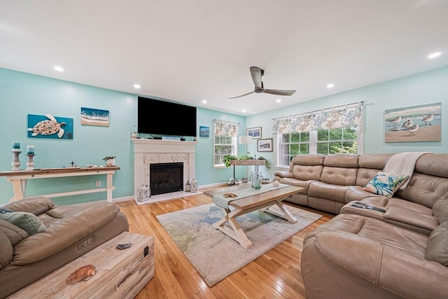 61 Hingham Ave, Marshfield, MA 02050 - living room with a ceiling fan, light wood finished floors, a fireplace with flush hearth, recessed lighting, and baseboards