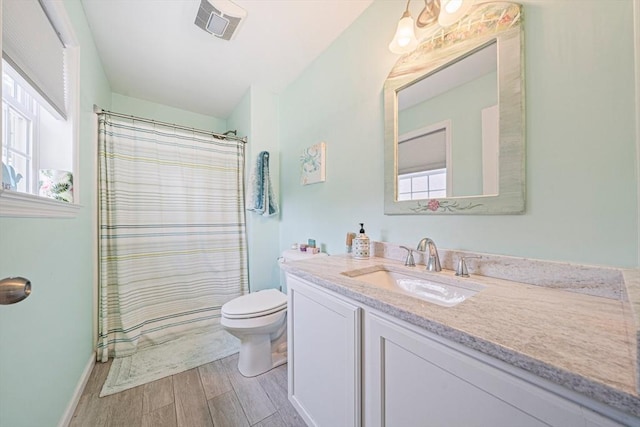 61 Hingham Ave, Marshfield, MA 02050 - bathroom featuring vanity, wood finished floors, toilet, and plenty of natural light