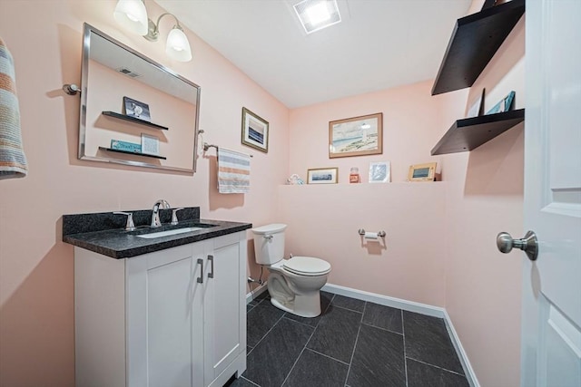 61 Hingham Ave, Marshfield, MA 02050 - bathroom with toilet, baseboards, vanity, and tile patterned flooring